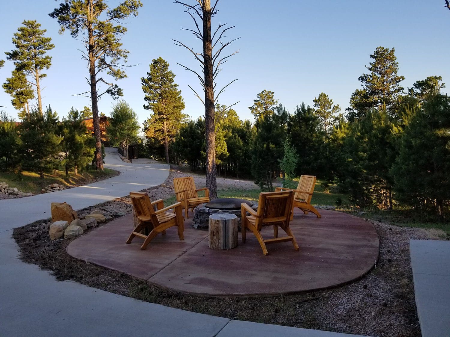 Outside patio view of fire pit and seating.